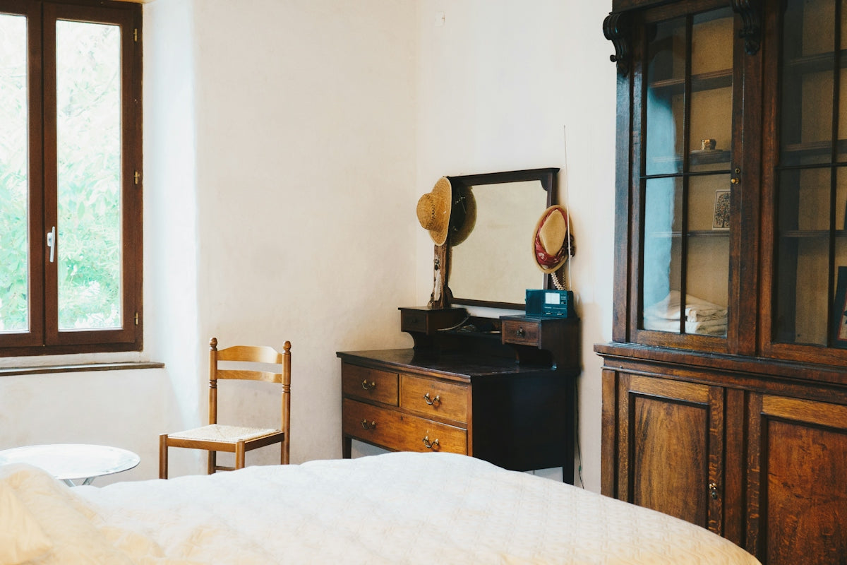 a room with a bed and a mirror