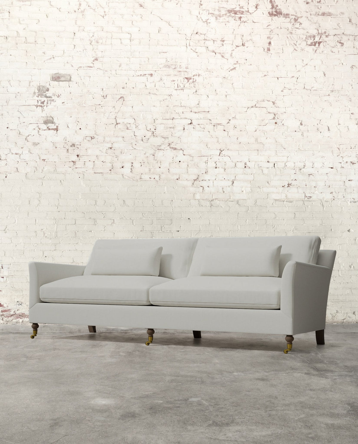 Mavelle Alfie 97" Sofa with Brass Casters sofa - Styled in Room