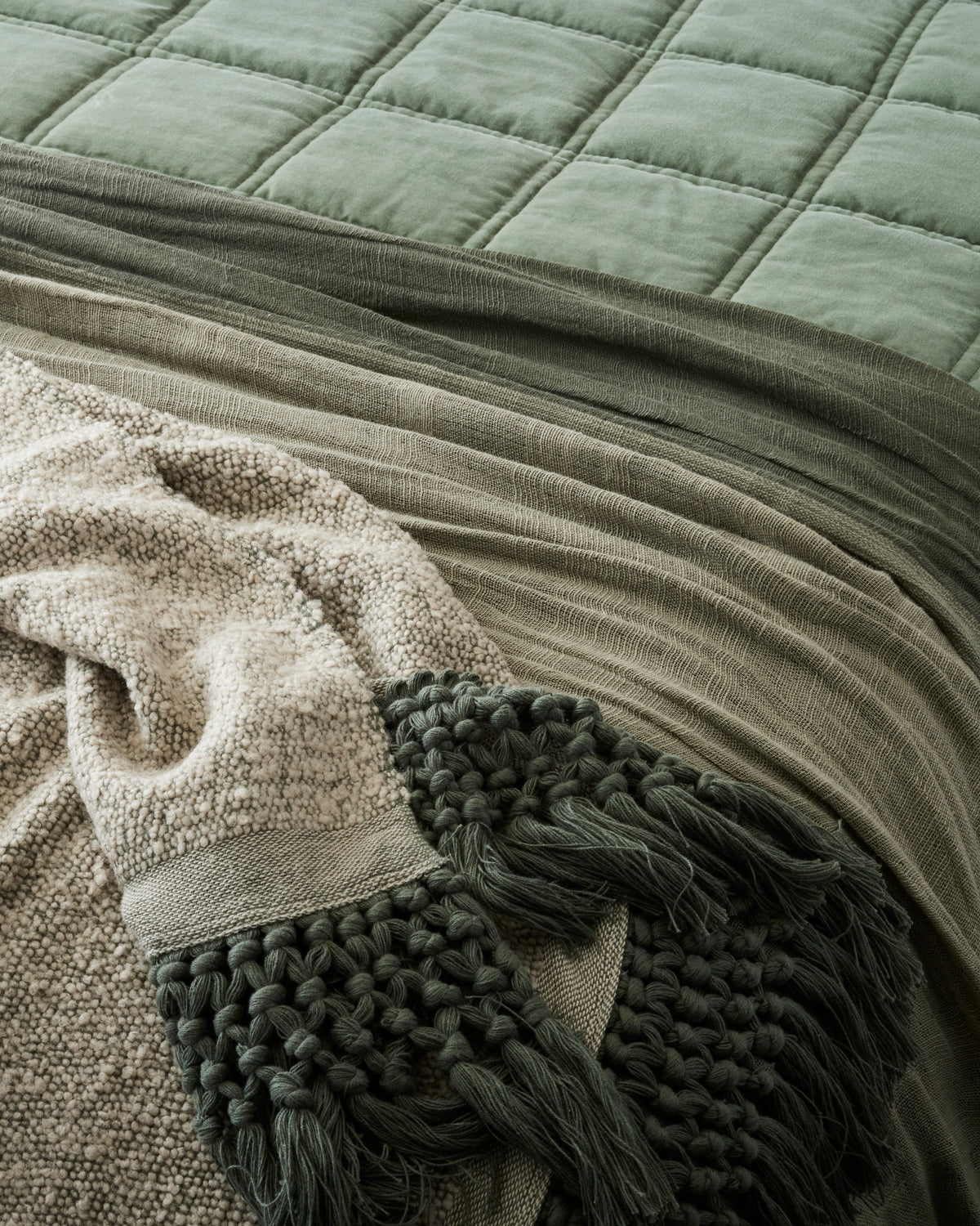 Mavelle Dusty Green Essential Tassel Throw throw blanket - Styled in Room
