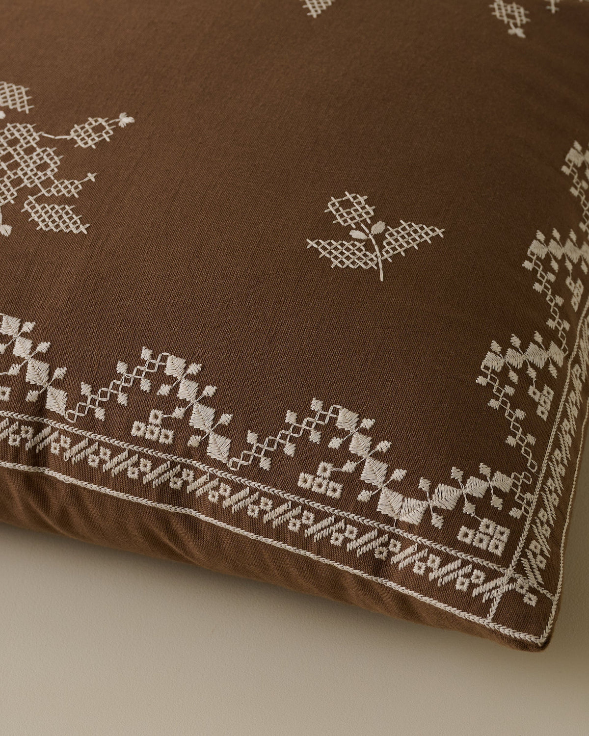 Mavelle Lacey Embroidered Throw Pillow throw pillow - Styled in Room