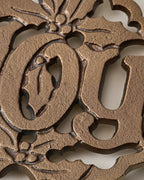 Mavelle Cast Antique Brass Joy Trivet trivet - Styled in Room