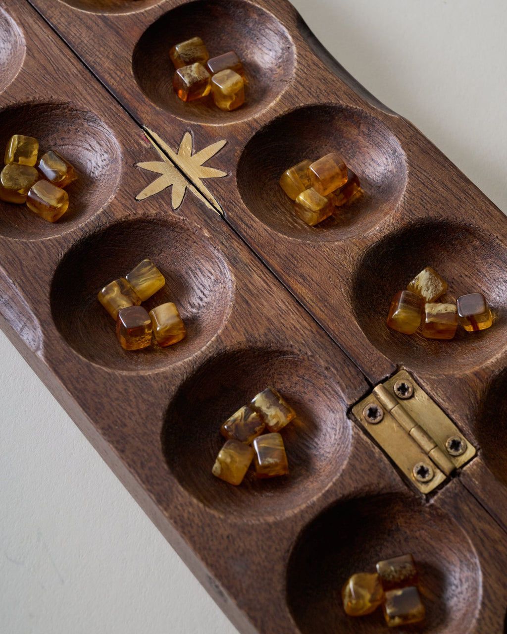 Mavelle Wood and Brass Inlay Star Mancala decorative accent - Styled in Room