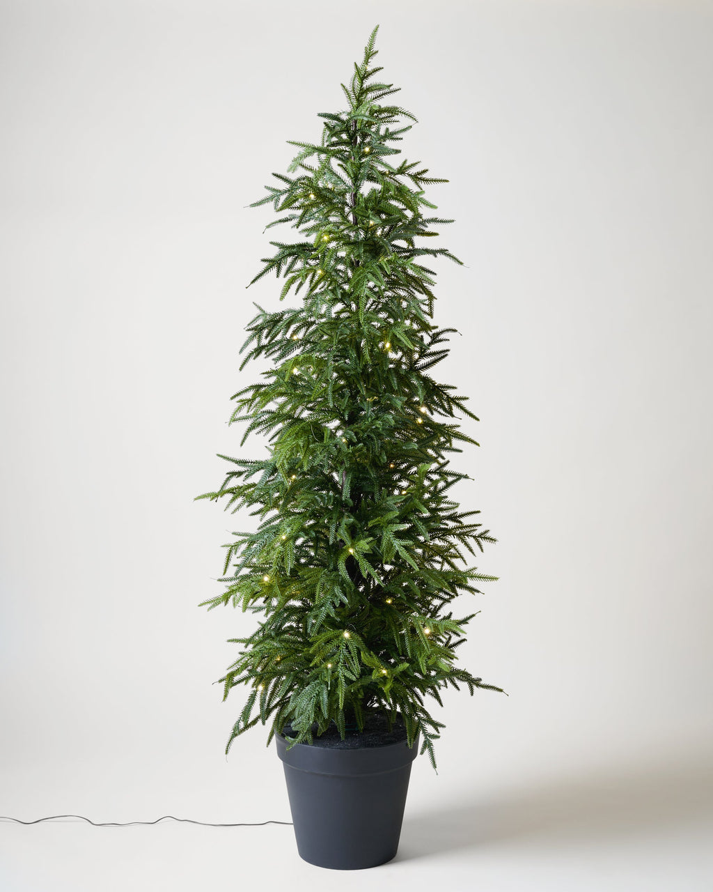 Mavelle Real Touch Norfolk Pine Pre-Lit Potted Tree faux floral stem